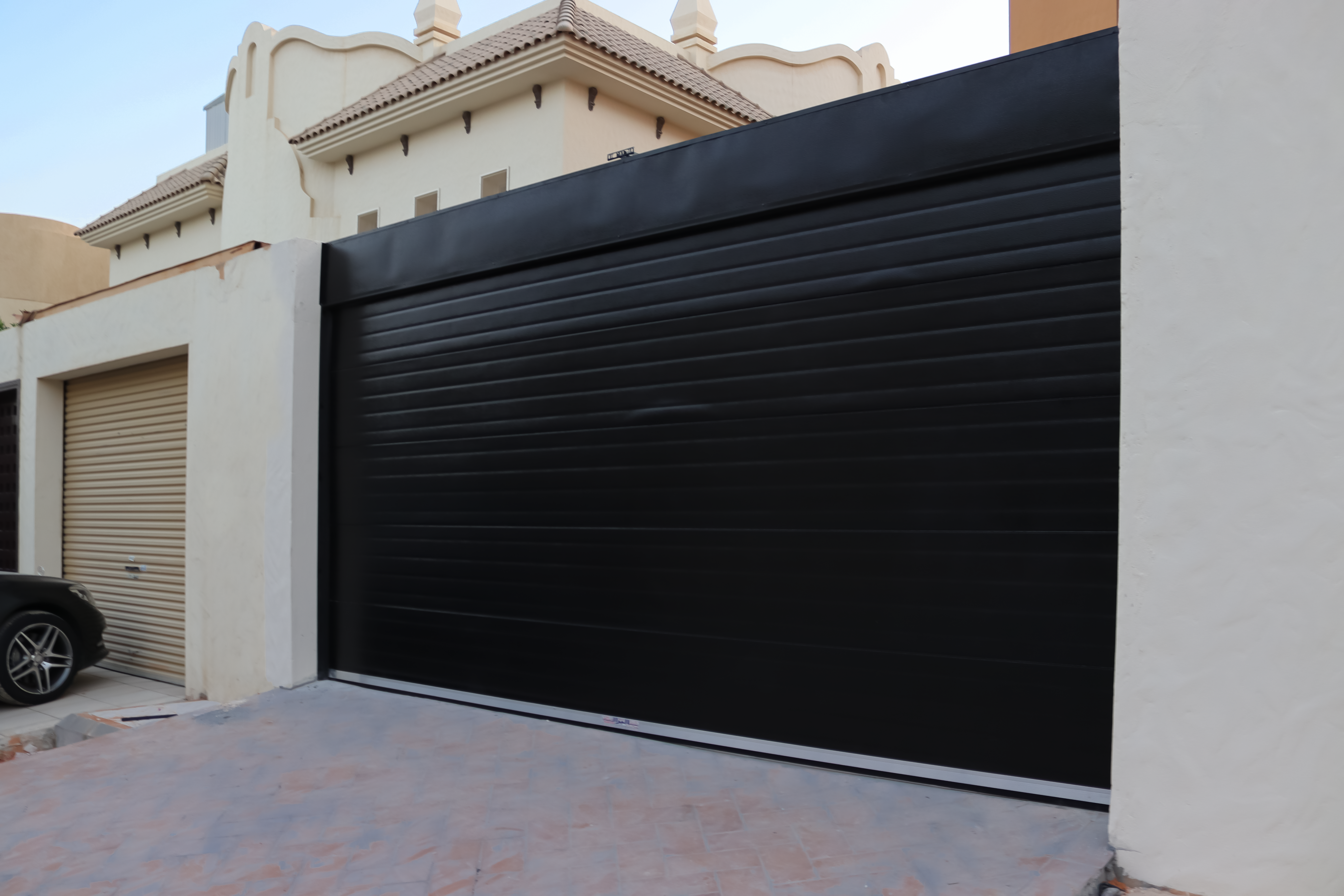 Residential roll-up garage door providing durability, and modern style